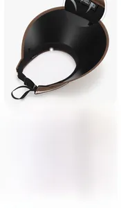 Detail of adjustable windproof strap on a wide-brimmed straw sun visor for women