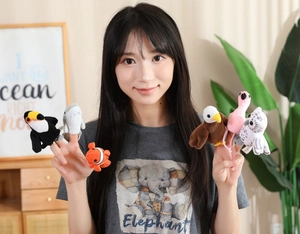 Detailed view of plush animal finger puppets including shark and toucan for early education