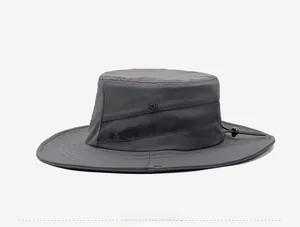 Detail view of quick-dry sun hat featuring breathable mesh side panels and adjustable chin strap
