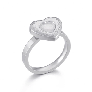Polished stainless steel heart ring with embossed dot texture on a white background
