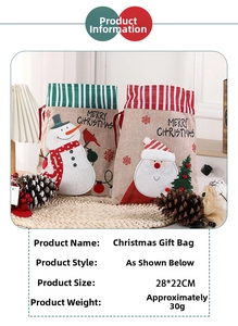 Detail view of linen Christmas gift bags with Santa patterns and 28x22cm dimensions
