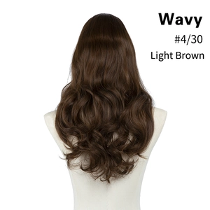 Rear view of long wavy hair extension in light brown mix color on a beige mannequin