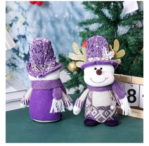 Front and back detail of purple sequined Santa gnome with golden antlers and knit texture