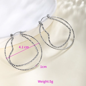 Detail of silver chain texture hoop earrings with dimensions 4.1cm and 5g weight