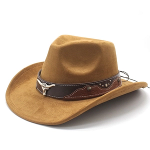 Detail of western cowboy hat with brown leather band and metallic bull head emblem