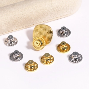 Gold and silver earring back lifters with mesh and hollow textures for support