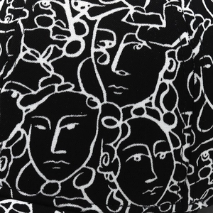 Detailed view of artistic white line portrait print on premium black cotton baseball cap