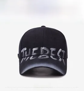 Front view of vintage washed baseball cap featuring white THE BEST graffiti print