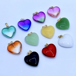 Colorful heart-shaped glass pendants in various vibrant shades with gold metal loops