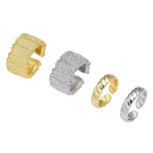 Adjustable wide open rings set with irregular tree bark and twisted rope textures