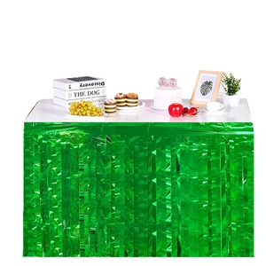 Green foil fringe table skirt for American football themed birthday party decorations