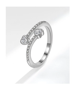 Close-up of a silver open ring featuring double bands and heart-shaped zircon stones