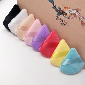 Set of 8 triangular velvet powder puffs in diverse colors with a wooden gift box