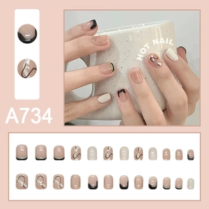 Minimalist nude pink press-on nails set with elegant black and white streamline designs