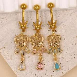 Detailed view of hollow heart belly rings with multi-color teardrop zircon stones