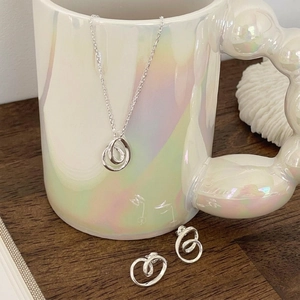 Minimalist 925 sterling silver necklace and earrings set with twisted double ring design