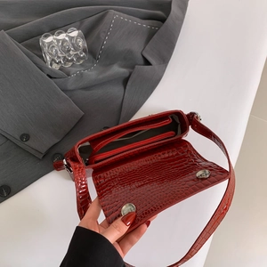 Elegant red crocodile pattern handbag with shoulder strap and magnetic closure