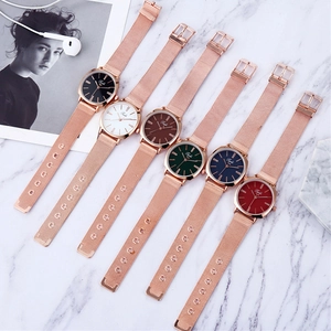 Detailed display of six elegant women's quartz watches with rose gold mesh bands