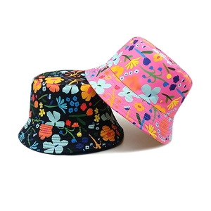 Vibrant floral bucket hats for kids with colorful petal prints on black and pink base