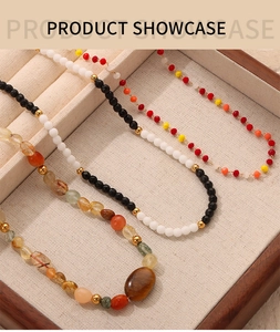 Detailed view of handmade beaded necklaces with natural stones and gold spacer beads