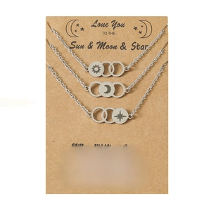 Three stainless steel sun moon star circle necklaces on kraft card with heartfelt message