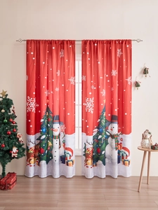 Detail of Christmas snowman curtains with festive tree and reindeer prints in home setting