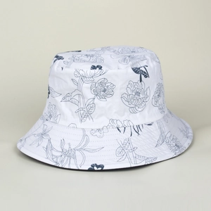 Detail of white cotton bucket hat with blue peony print and reinforced brim stitching
