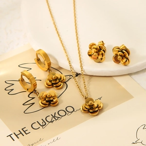 Elegant gold camellia jewelry set with layered flower necklace and stud earrings