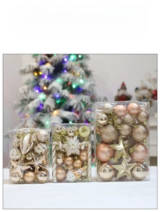 Detail of Christmas ornament set with champagne gold baubles and festive holiday shapes
