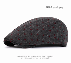 Detailed macro view of dark gray fabric with red heart embroidery and fine white stripes