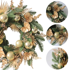 Green PE Christmas wreath with gold balls and velvet flowers on white background