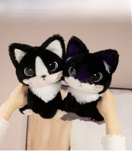 Close-up of cute plush cat toys with big eyes, soft fur details and pink paw pads