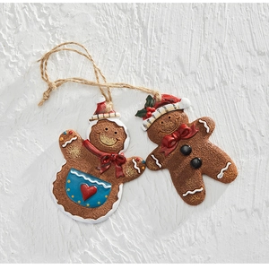 Close-up of resin gingerbread man and woman Christmas ornaments with rustic jute rope hanging