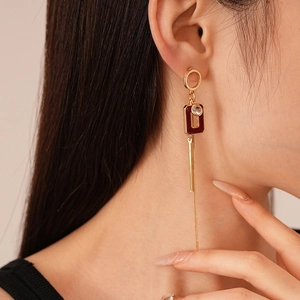 Vintage geometric tassel earrings with burgundy acrylic accents and dangling gold chains