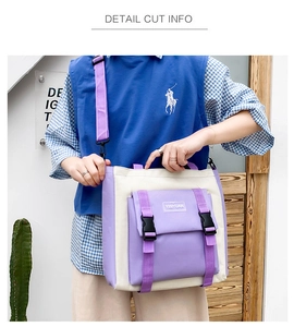 Detail view of canvas tote bag with front buckle pocket and adjustable purple strap