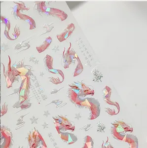 Detail of 5D holographic dragon nail art stickers with traditional clouds and flowers