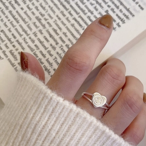 Minimalist 925 sterling silver heart smile ring with woven band on female finger