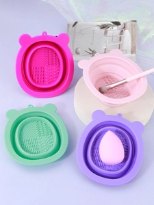 Detailed view of foldable silicone makeup brush cleaning bowls in four pastel colors
