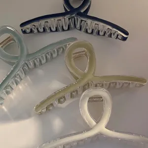 Chic loop hair claws in blue, green, and white colors with gold metal springs