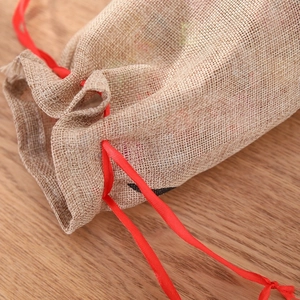 Rustic elk reindeer burlap wine bottle bag with vibrant red satin drawstring closure