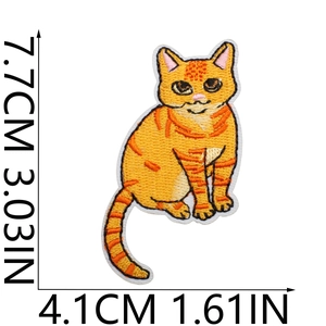 Detail showing dimensions of an orange cat embroidery patch on a white background