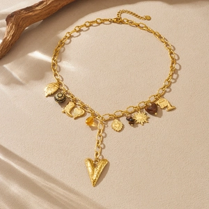 Vintage gold plated stainless steel necklace with heart, sun and leaf charms