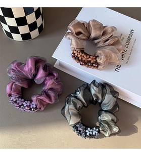 Three-piece organza scrunchie set with beads and floral charms in purple and brown