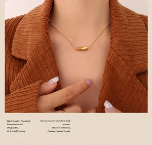 Close-up of 18k gold plated titanium steel twisted necklace worn on woman neck