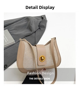 Detail view of the crescent shoulder bag showing beige leather and woven fabric texture
