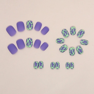 Short square press-on nails with purple matte finish and green cow print patterns