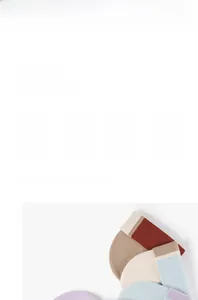 Detailed view of color-block knit beanie showing soft ribbed texture and warm yarn fabric