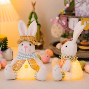 Close-up of glowing Easter plush bunnies in yellow plaid outfits for home decoration