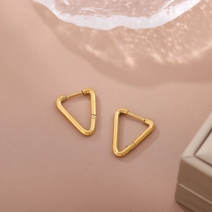 Minimalist 18K gold-plated stainless steel triangle earrings on elegant pink fabric