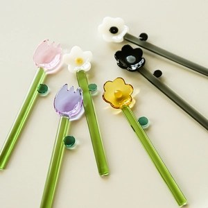 Set of six long colorful borosilicate glass spoons with decorative floral flower tops